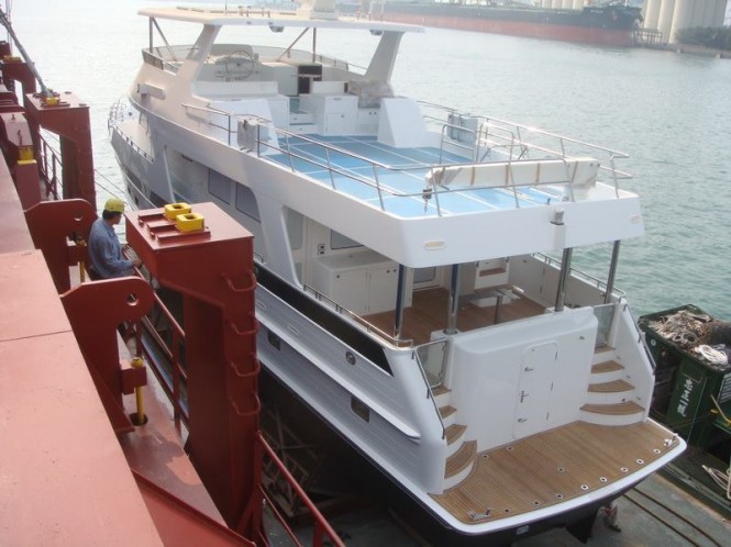 Photos of new Outer Reef 700 Yacht being loaded on a ship in Taiwan