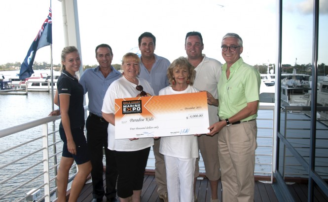 Expo representatives present the cheque to Paradise Kids Expo representatives present the cheque to Paradise Kids