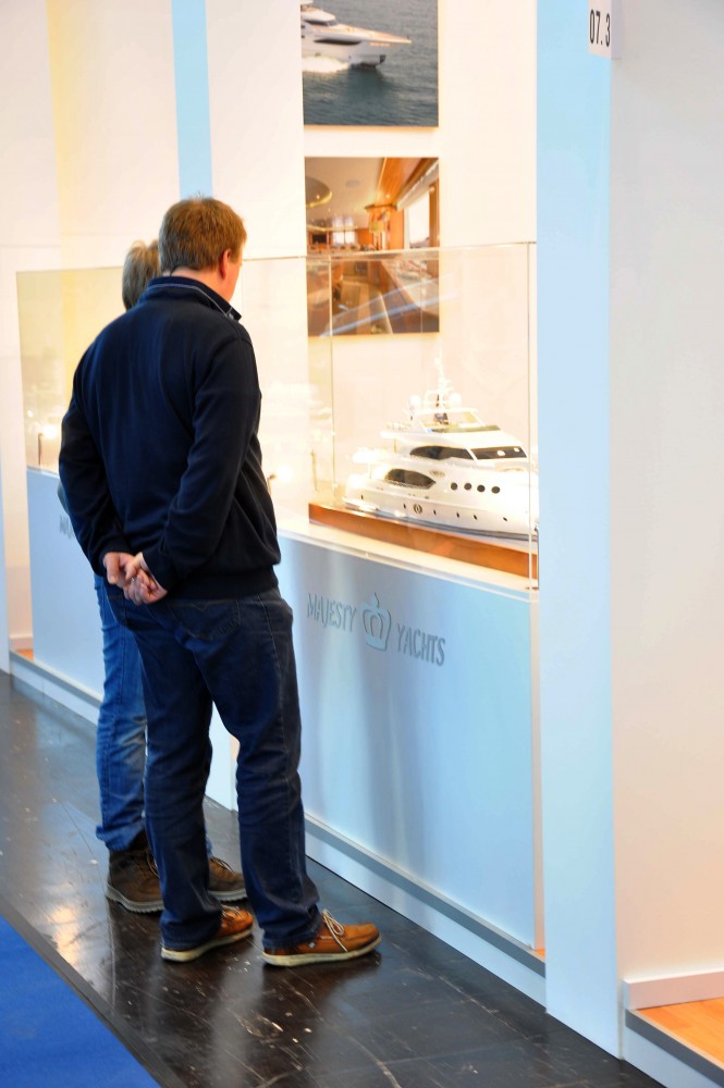 Guests checking out the Majesty 135 scale model at the Dusseldorf Boat Show 2014