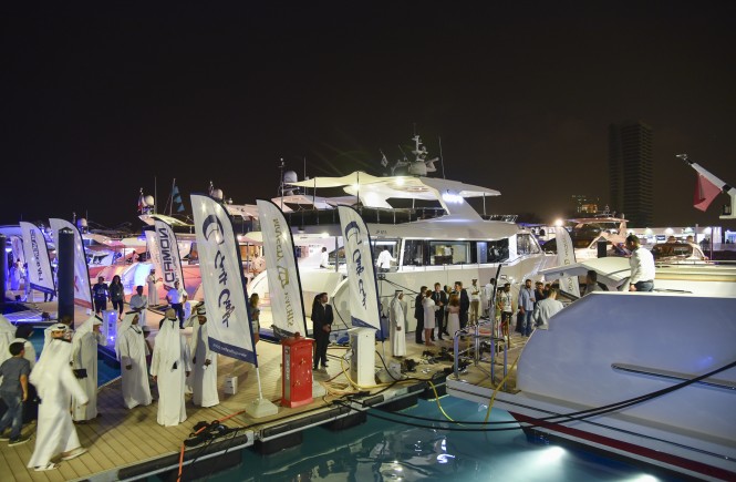 Visitors at the Qatar International Boat Show 2015 cue to view the Gulf Craft fleet