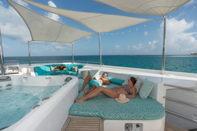Enjoying the lovely sunshine and summer breeze around the Jacuzzi aboard RHINO