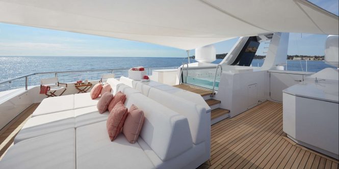 Shaded sundeck sunpads and Jacuzzi aboard M/Y JOY