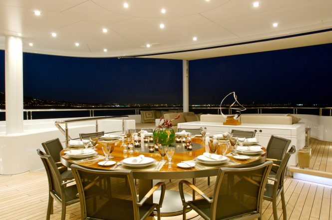 Superyacht SIREN - Alfresco dining on the main deck aft. Photo credit Nobiskrug