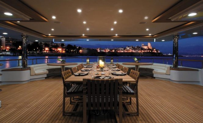 Beautiful aft deck alfresco dining set up in the evening