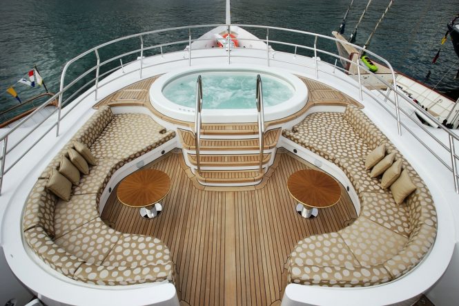 Jacuzzi with plenty of lounging and sunbathing space around