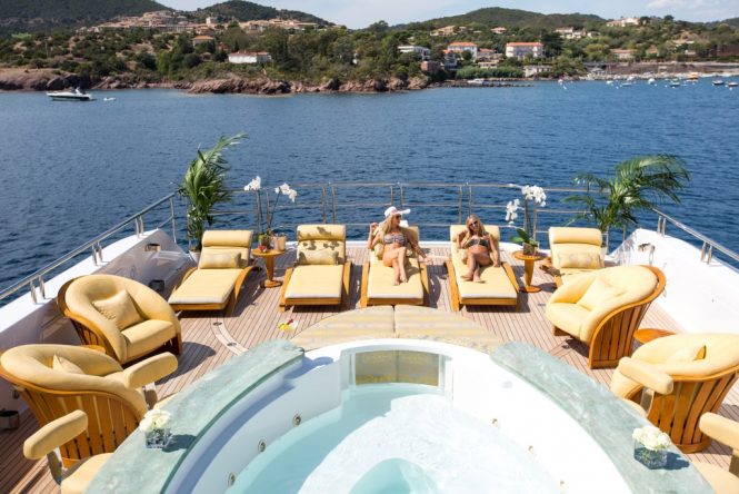 Relaxing on the sun deck with Jacuzzi and plenty of space for sunbathing