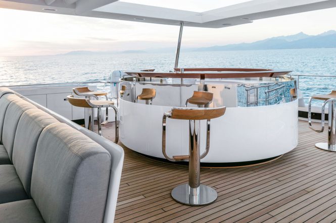 Exterior deck with bar and seating