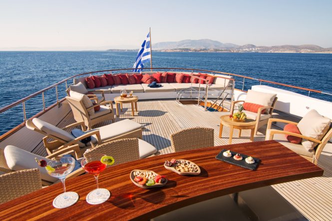 Sun deck with plenty of seating and a wet bar