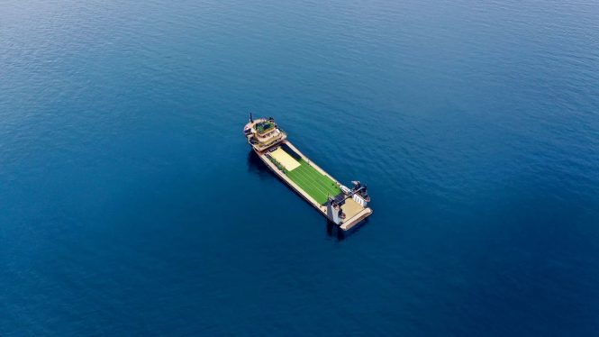 aerial view of the 146m explorer yacht OK with a tennis court © Karmarine Shipyard