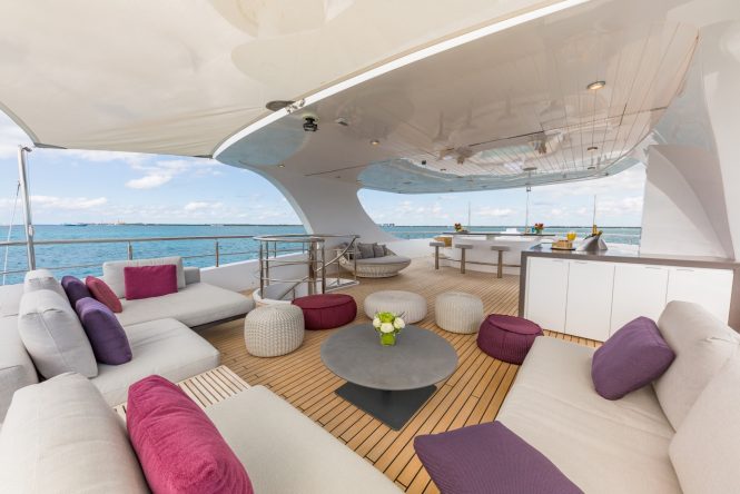 Sun deck with sofas, dining and jacuzzi