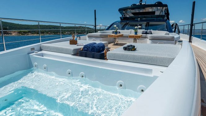 Bow sunbathing and glass fronted  jacuzzi