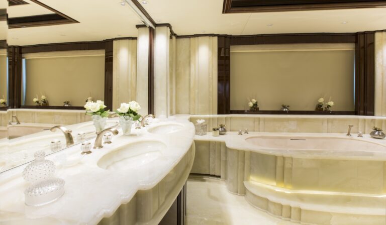marble guest bathroom with a huge bath