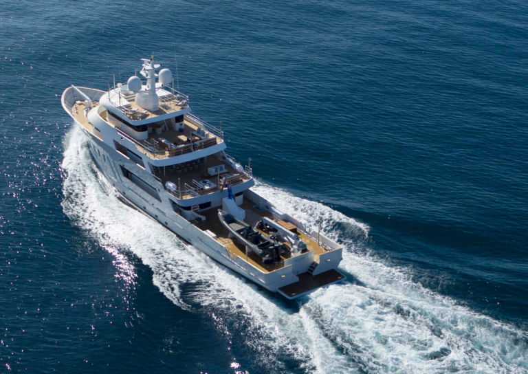 Aerial Fo The Yacht Running - Aft View
