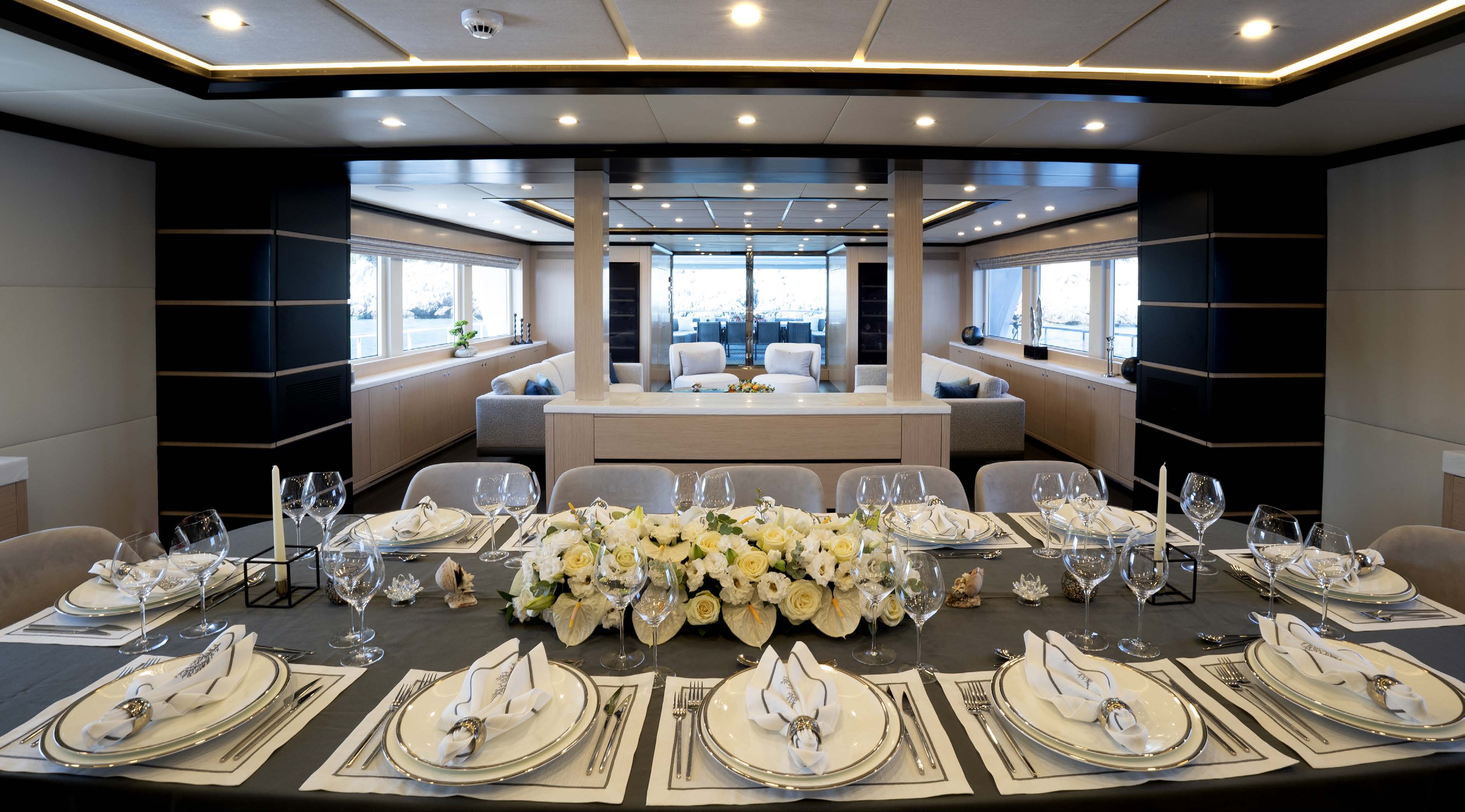 304 Main salon dining - table set for dinner.jpg