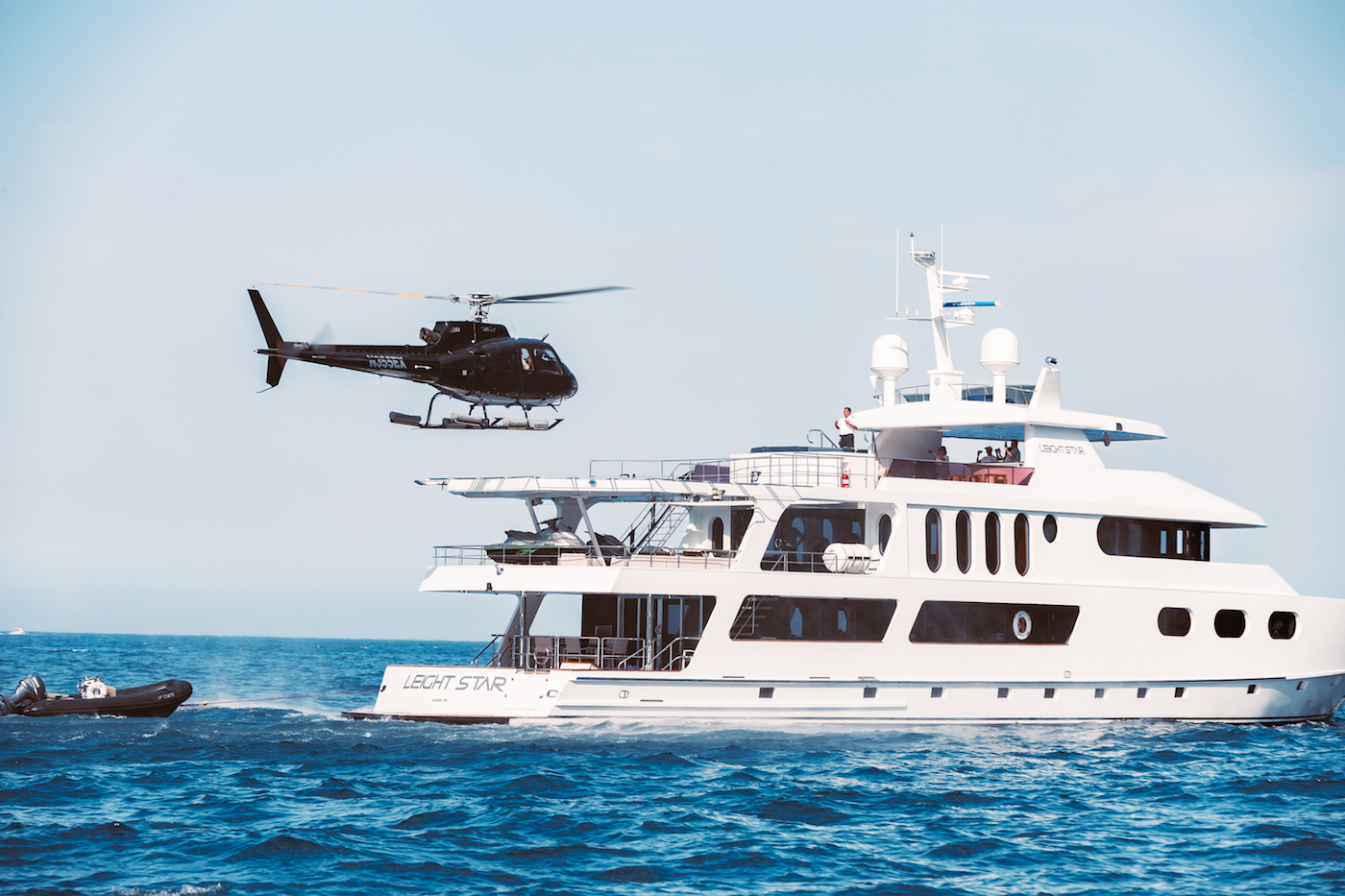 LEIGHT STAR yacht with helicopter arriving on board.jpg