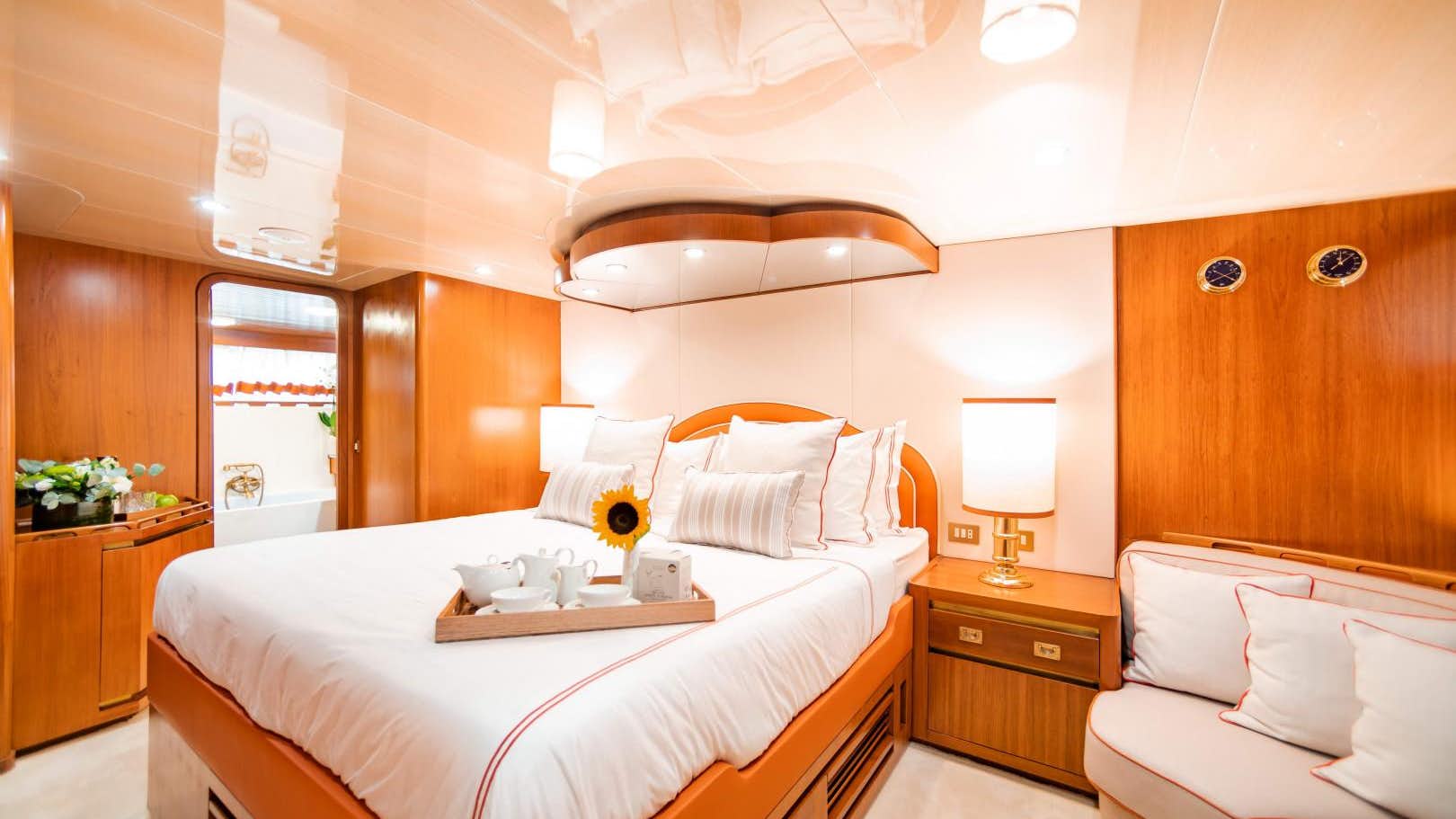a bedroom with a bed and a table aboard_yyth.jpg