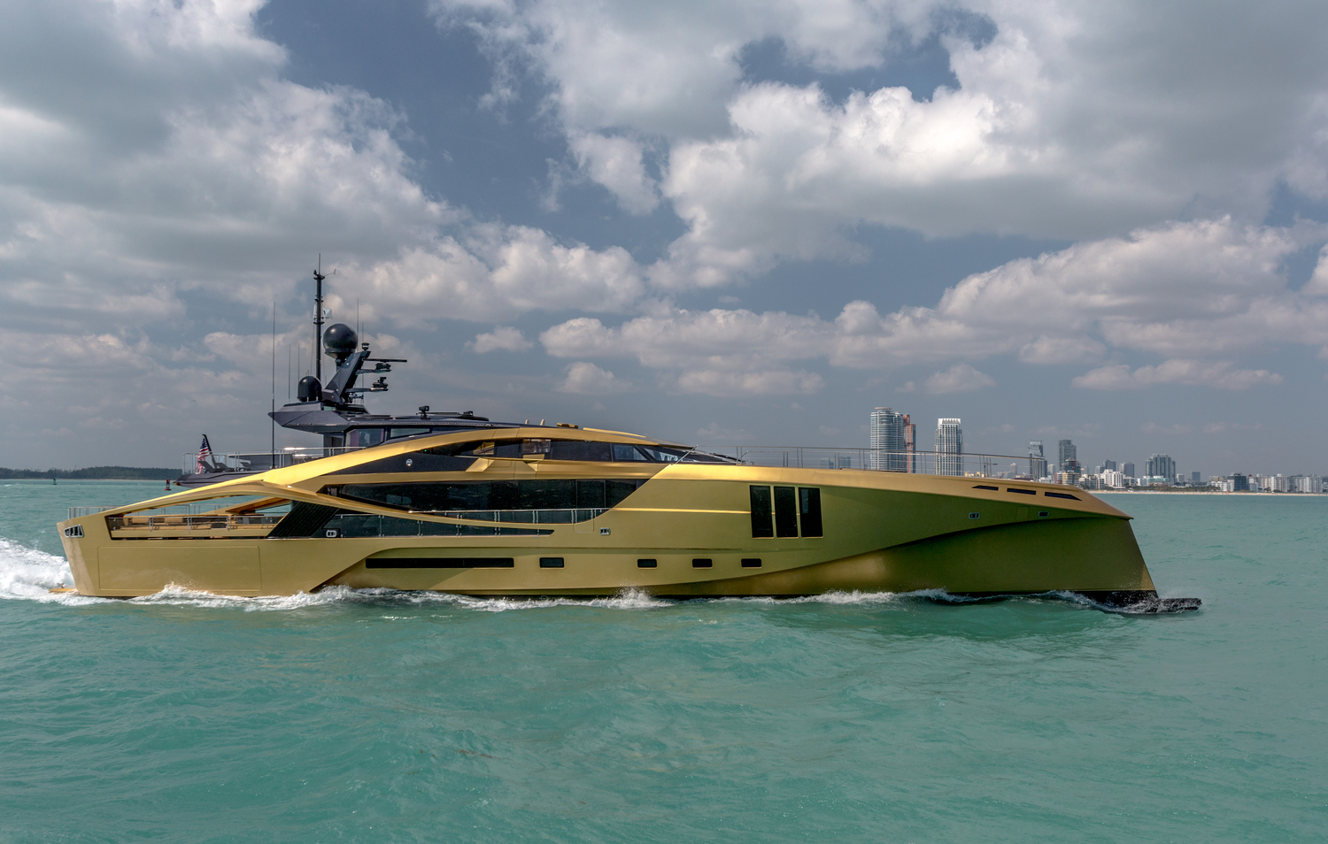 running profile of the golden coloured yacht by Palmer Johnson.jpg
