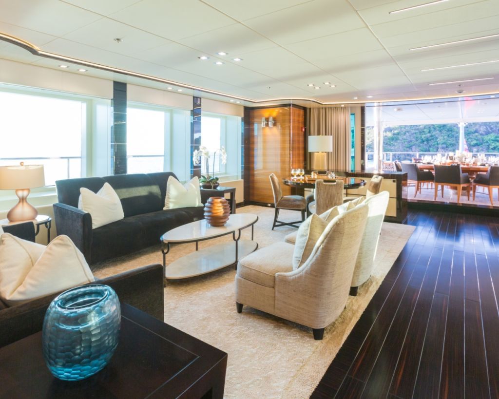 saloon with games table and lounging area with alresco dining further aft.jpg