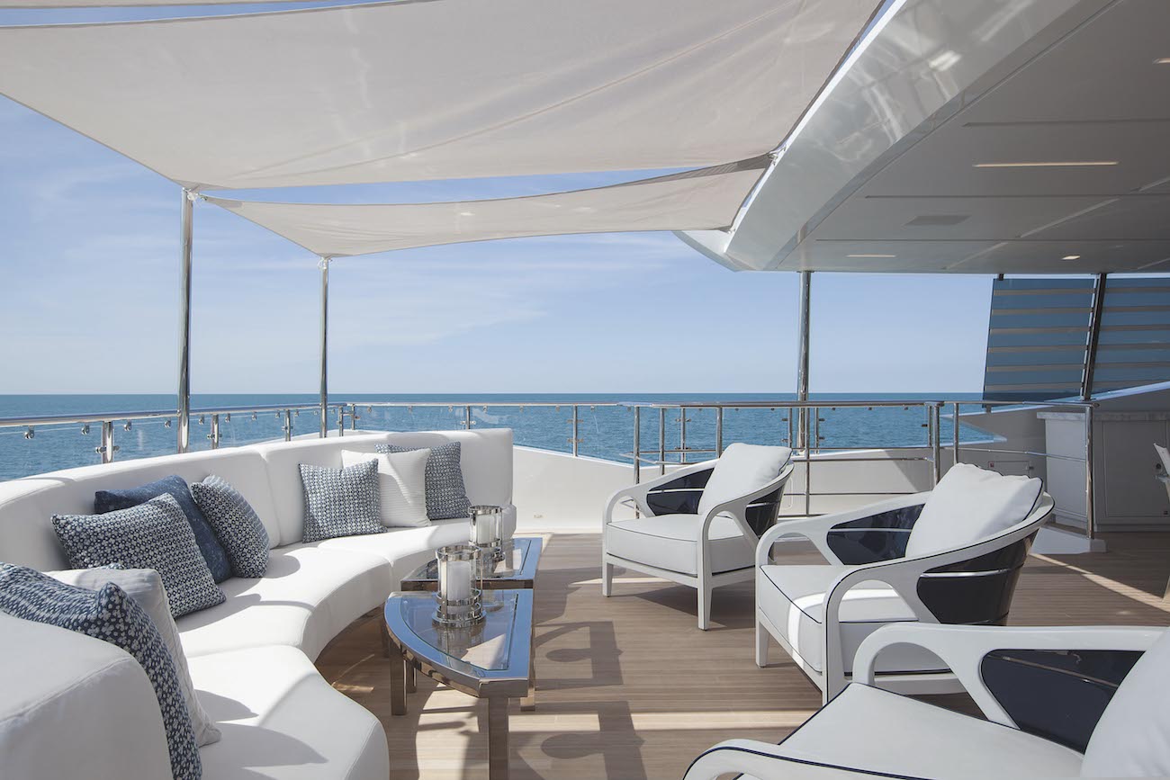 upper deck aft seating and coffee tables on the outside.jpg