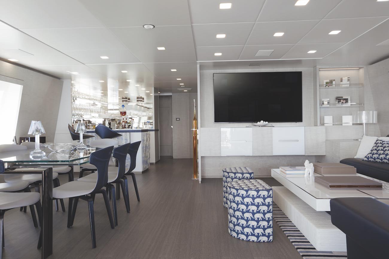 upper deck lounge with TV and dining table on the left.jpg