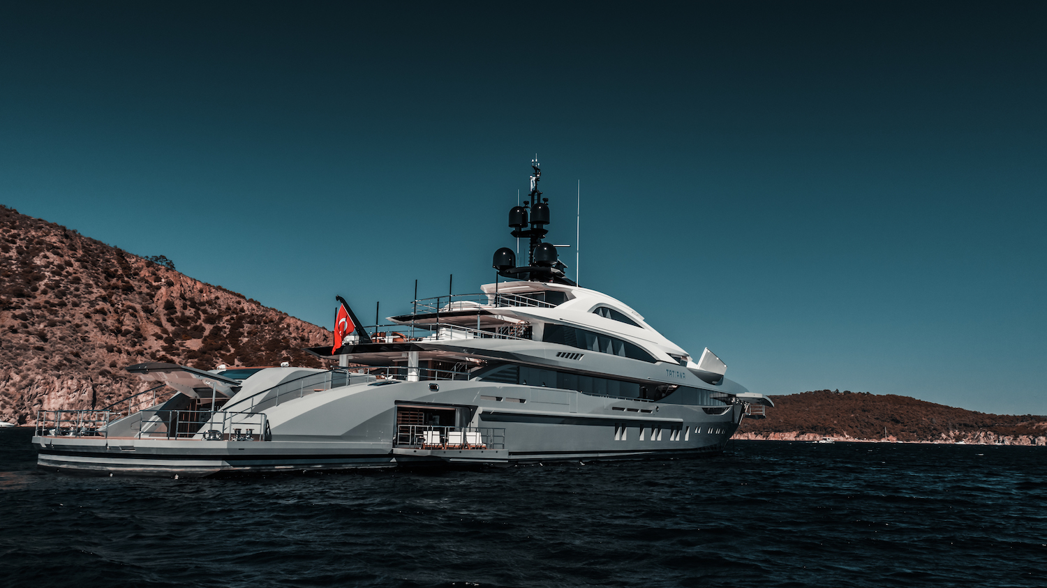 yacht at anchor with open beach club.jpg