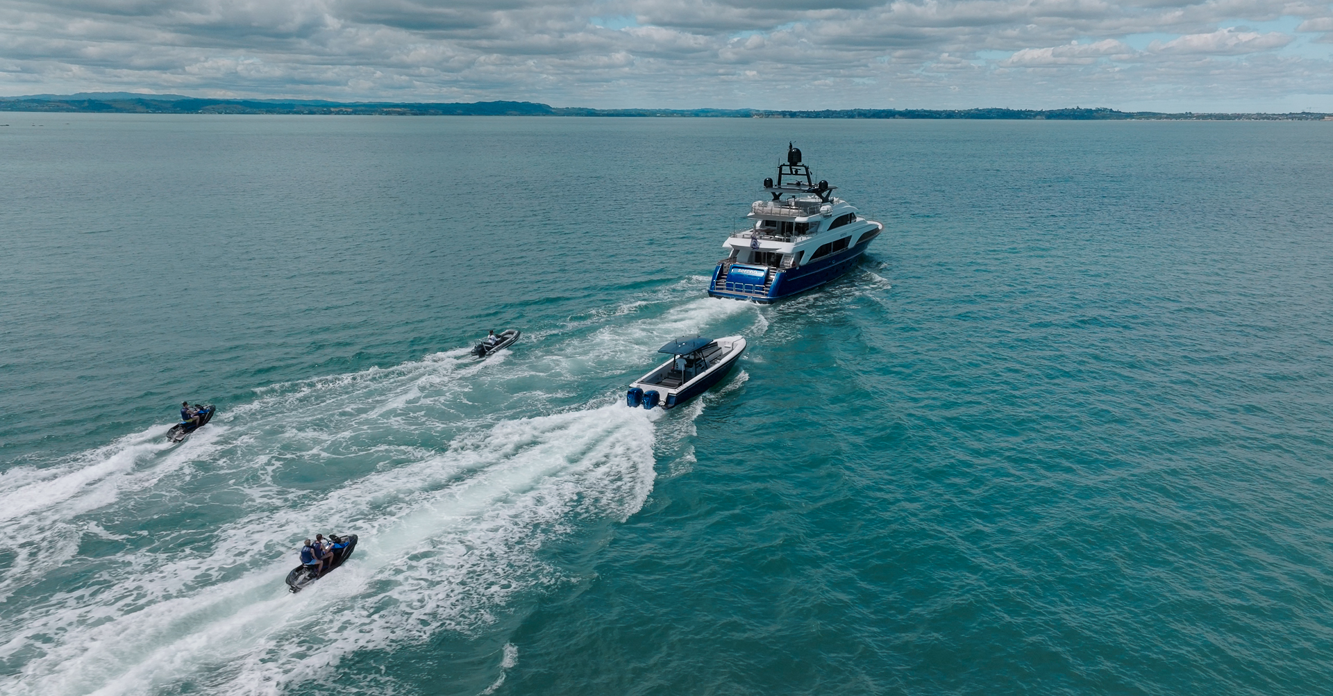 yacht with tenders and jetskis.jpg
