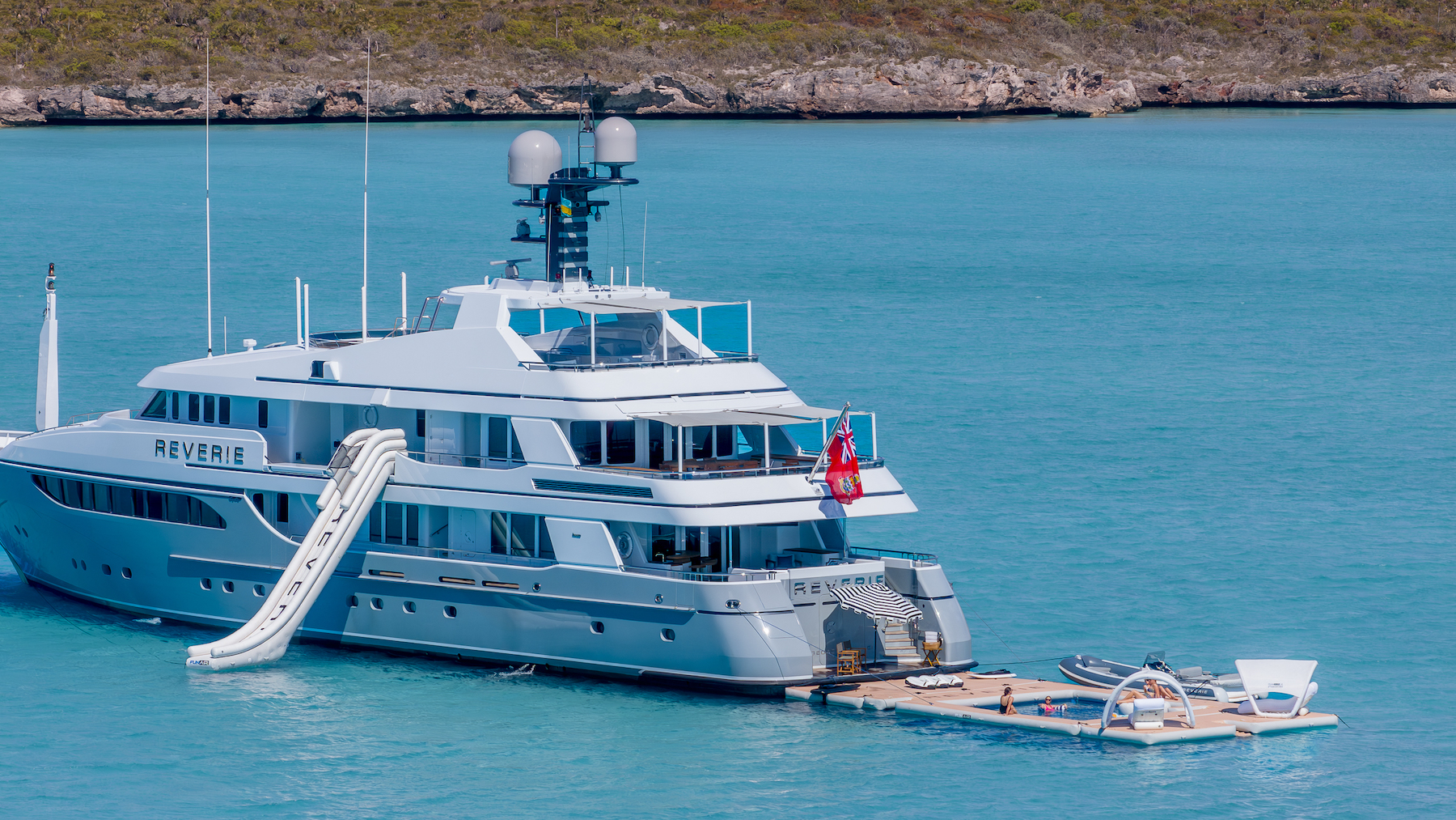 Luxury yacht REVERIE at anchor with the inflatable pool and sunbathing area.jpg