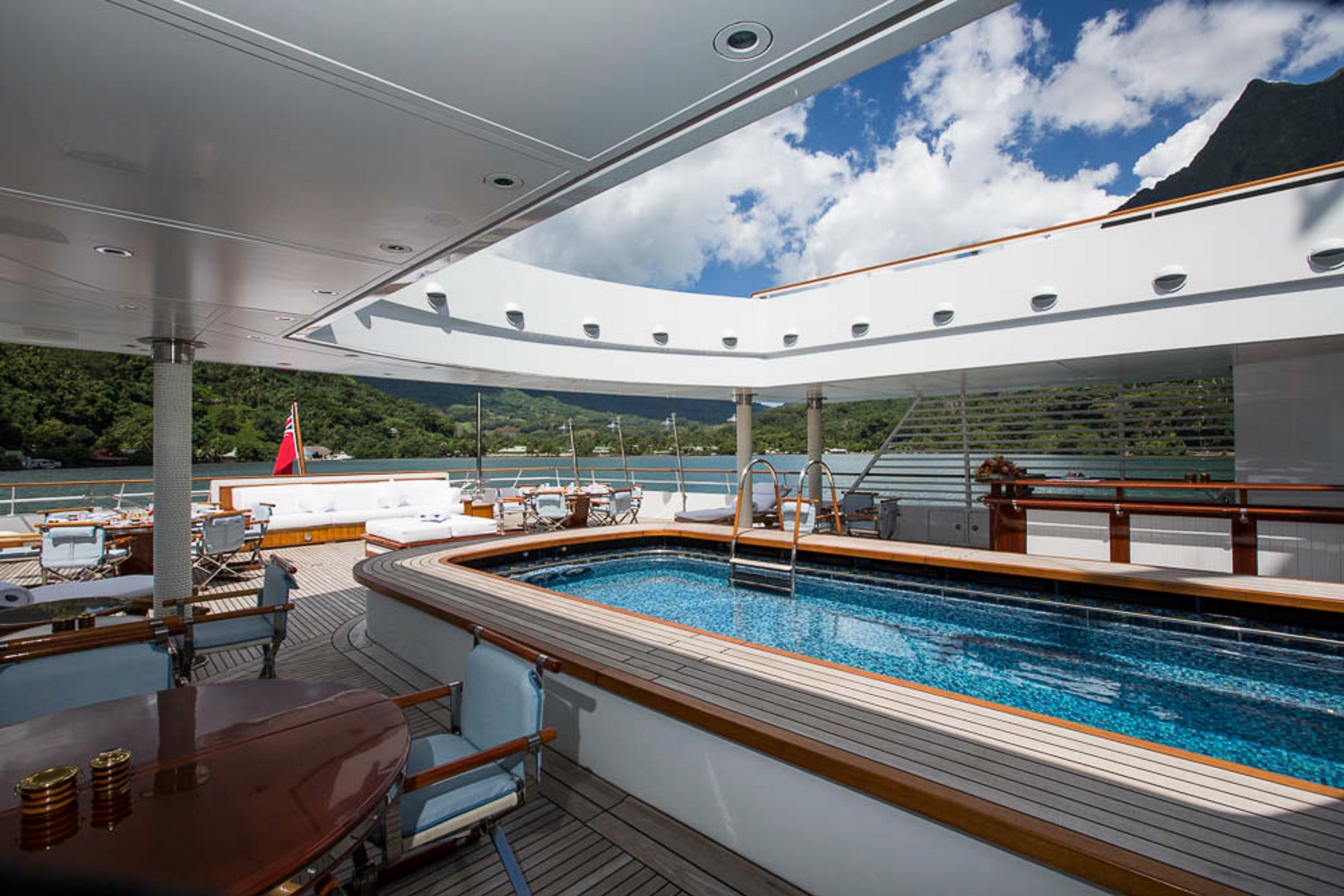 Massive swimming pool and aft deck with bar and seating.jpg