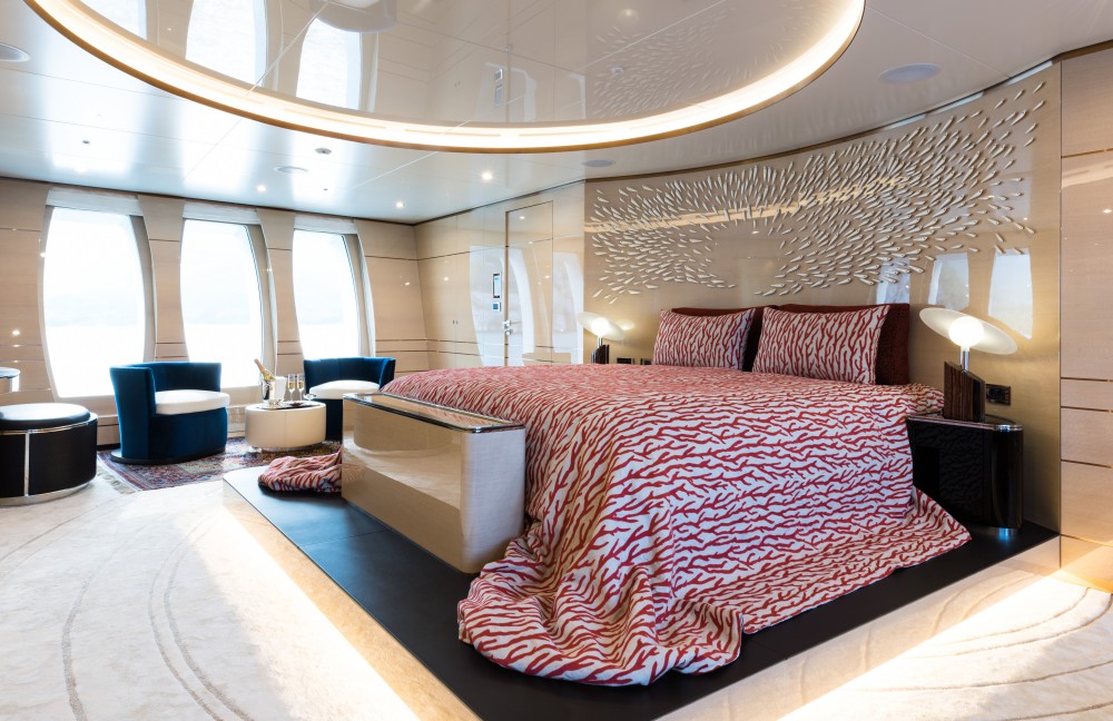 master suite with beautiful bedding and seating area.jpg