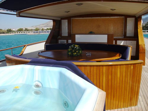 Motor yacht MONACO -  Top deck dining and Spa Pool.jpg
