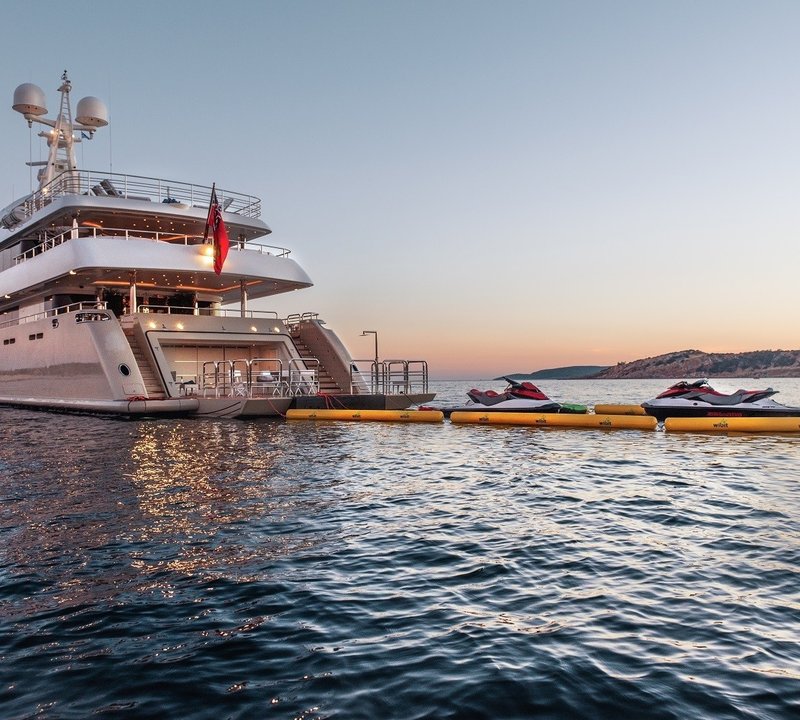sunset aft view with beach club and water toys
