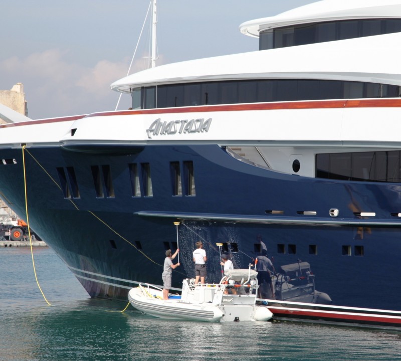 Crew cleaning yacht in Antibes | Motor yacht Anastasia - Photo Credit Monaco Yacht Spotter